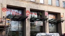 Extinction Rebellion climate change protesters graffiti Shell HQ in London