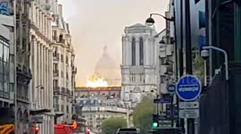 Walking up to see the Notre Dame de Paris on fire with massive flames!