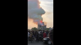 Helpless Parisians watch Notre Dame burn from nearby bridge