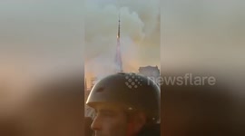 Moment Notre Dame's spire collapses during fire