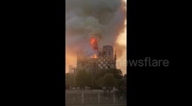 Shocking moment iconic Notre-Dame spire collapses into flames