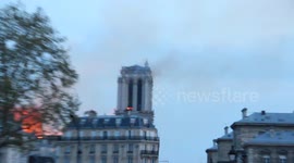 Flames lick the insides of Notre Dame Cathedral bell towers threatening to collapse the bells inside.