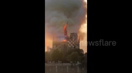 Shocking moment iconic Notre-Dame spire collapses into flames