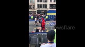 Marine running in honour of fallen comrades crawls to Boston Marathon finish line