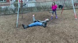 Canada dad ends up flat on his back after failed flip off swing set