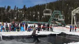 Snowboarder clears 60ft pond before somersaulting at California ski resort