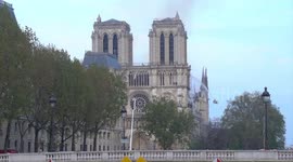 First responders at scene of Notre Dame fire as Parisians look on