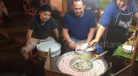 Thai man cook meatballs extremely fast