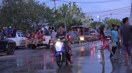 Songkran festival celebrations in Thailand, everyone and everything on the street gets splashed, even a passing bus, its all great fun.