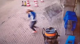 Chinese man has lucky escape avoiding falling marble blocks