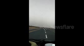 Hero driver saves motorbiker as he cruises down highway unaware that his bike is on fire