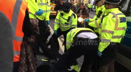 Extinction Rebellion activists carried away by police on second day of protests in London