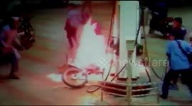 Horrifying moment motorbike catches fire at petrol pump in west India