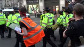 UK police arrest climate change protesters in Oxford Circus, London