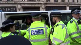 Extinction Rebellion - young man is being arrested and searched by police at Oxford Circus on day 3 of climate change protests in central London