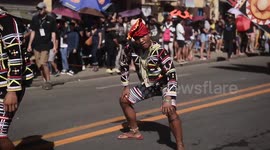 Filipino teenagers imitate monkeys at tribal festival to help them grow into men