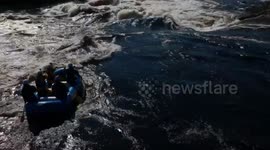 White water raft carrying 5 people is flipped over by huge wave on Gatineau River, Canada
