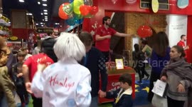 Easter fun at Hamleys Regent Street with a clown chasing customers around the store with soap bubbles