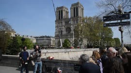 Parisians lay flowers at Notre Dame as forensics enter cathedral