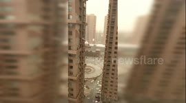 Powerful sandstorm peels wall off high-rise building in north China