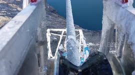Hypnotic cable reel shears ice off powerlines in Greenland