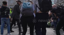 Extinction Rebellion geriactivist arrested by police in Oxford Street, London. Slo mo