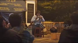 a young man played 2 pianika inflatable instruments and Minangkabau traditional flutes by echoing the singing tone of the Minang area