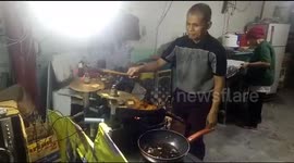Cook drums out some music while frying up his rice