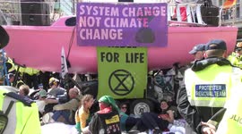 Police remove Extinction Rebellion protesters from pink boat on London's Oxford Street