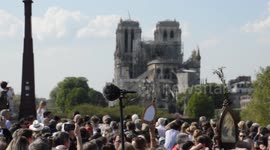 Huge crowd attends Good Friday procession by Notre Dame in Paris