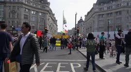 Extinction Rebellion in Oxford Street, London. Slo mo shot Inception style
