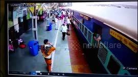 A woman  was saved as she fell from running train in India