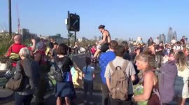 Extinction Rebellion Waterloo Bridge - fun in the sun with bicycle air salto and drums