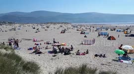 Hotter than Spain! Rare Easter heatwave packs Wales beach
