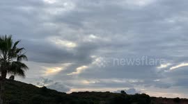 timelapse cloudy sun rise with landscape with palm tree