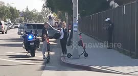 LAPD venice beach giving  Out tickets for not wearing a helmet on the E scooters