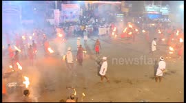Devotees throw fire at each other at Agni Kheli' Festival