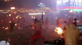 Indian devotees engage in fire-throwing fight to appease Hindu goddess