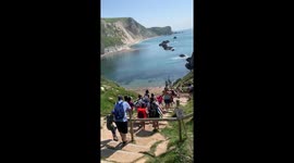 Parents ignore 'path closed' sign to take children to Dorset beach