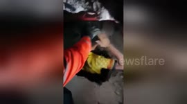 Dramatic moment survivor is pulled alive from rubble of earthquake-hit supermarket in the Philippines