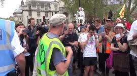 Extinction Rebellion crowd repeat instructions in bizarre call and response