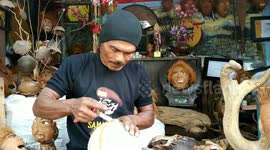 Indonesian man carves washed up coconuts and driftwood into amazing crafts
