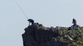 Spanish fishermen risk their lives catching sea bream from top of steep cliff