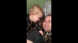 Mom asks for kiss, gets claws instead.