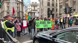 Protesters block traffic outside Bank of England for a second time this morning.