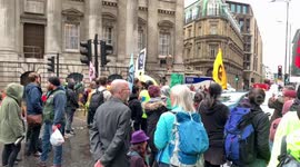 Protesters from Extinction Rebellion block traffic outside Bank of England for a second time this morning.