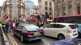 Protesters from Extinction Rebellion block traffic outside Bank of England for a second time this morning