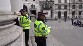 Police on duty outside The Royal Exchange as Extinction Rebellion target the City of London on the final day of climate change protests - 25 April