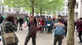 Extinction Rebellion protesters bang drums outside St Paul’s Cathedral in London
