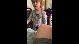 Cute moment girl aged 3 sings sweetly to baby sister to stop her from crying